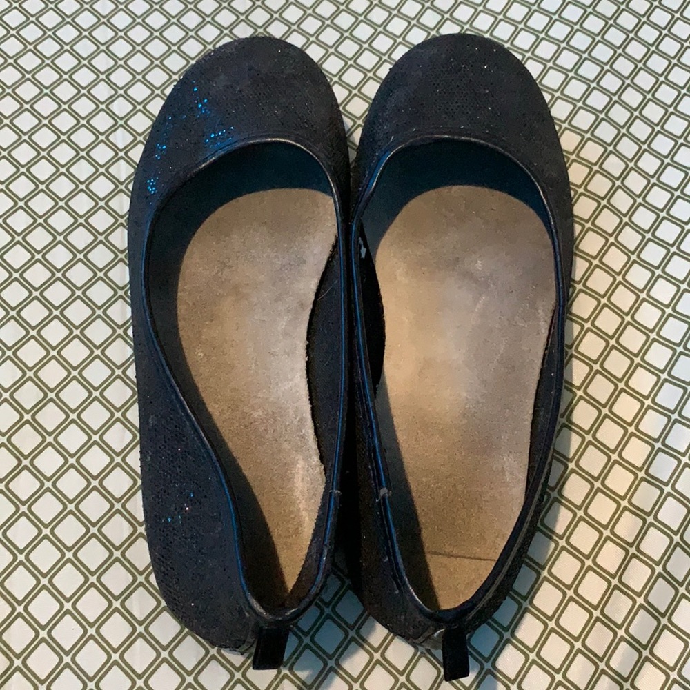 The flats are size 3 and the flip flops are size 6
